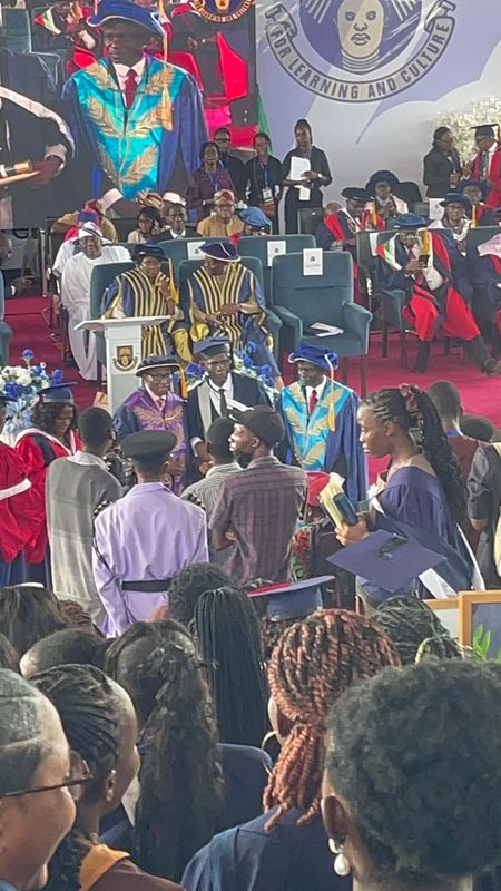 Joy receiving his award on stage at OAU's 48th Convocation